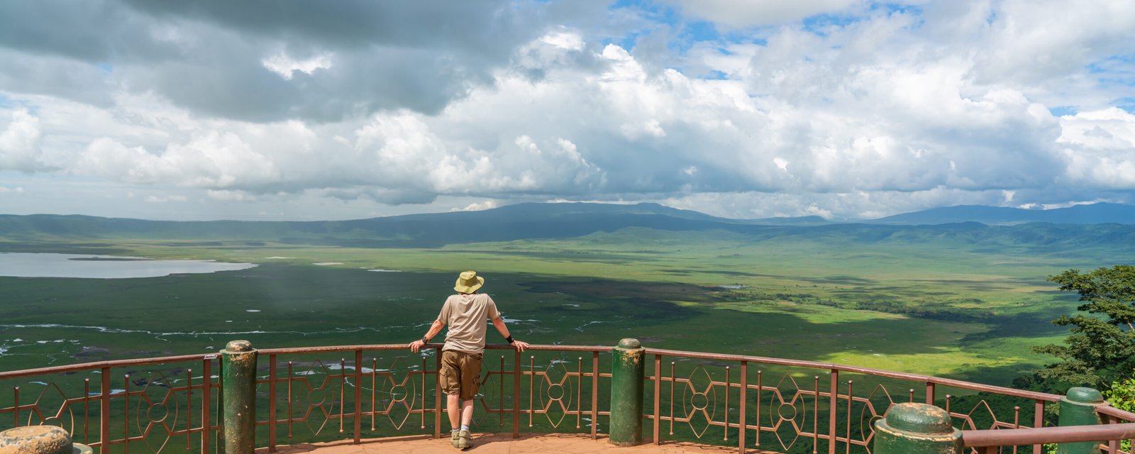 A,Single,Tourist,Looks,Into,The,Ngorongoro,Conservation,Area,With